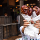 Close-Up Of Woman Holding Roasted Turkey Leg